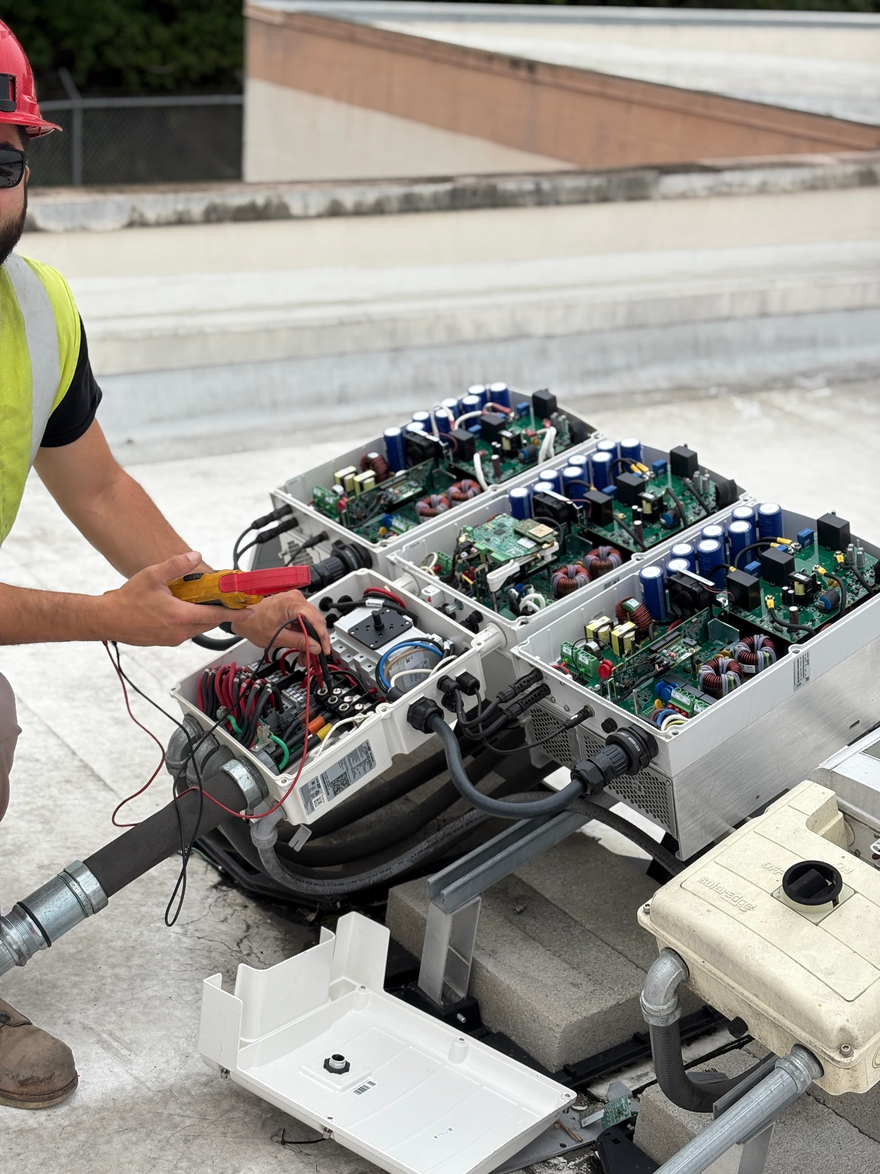 RCH Renewables C-10 licensed electrician inspecting commercial solar inverter, North County San Diego