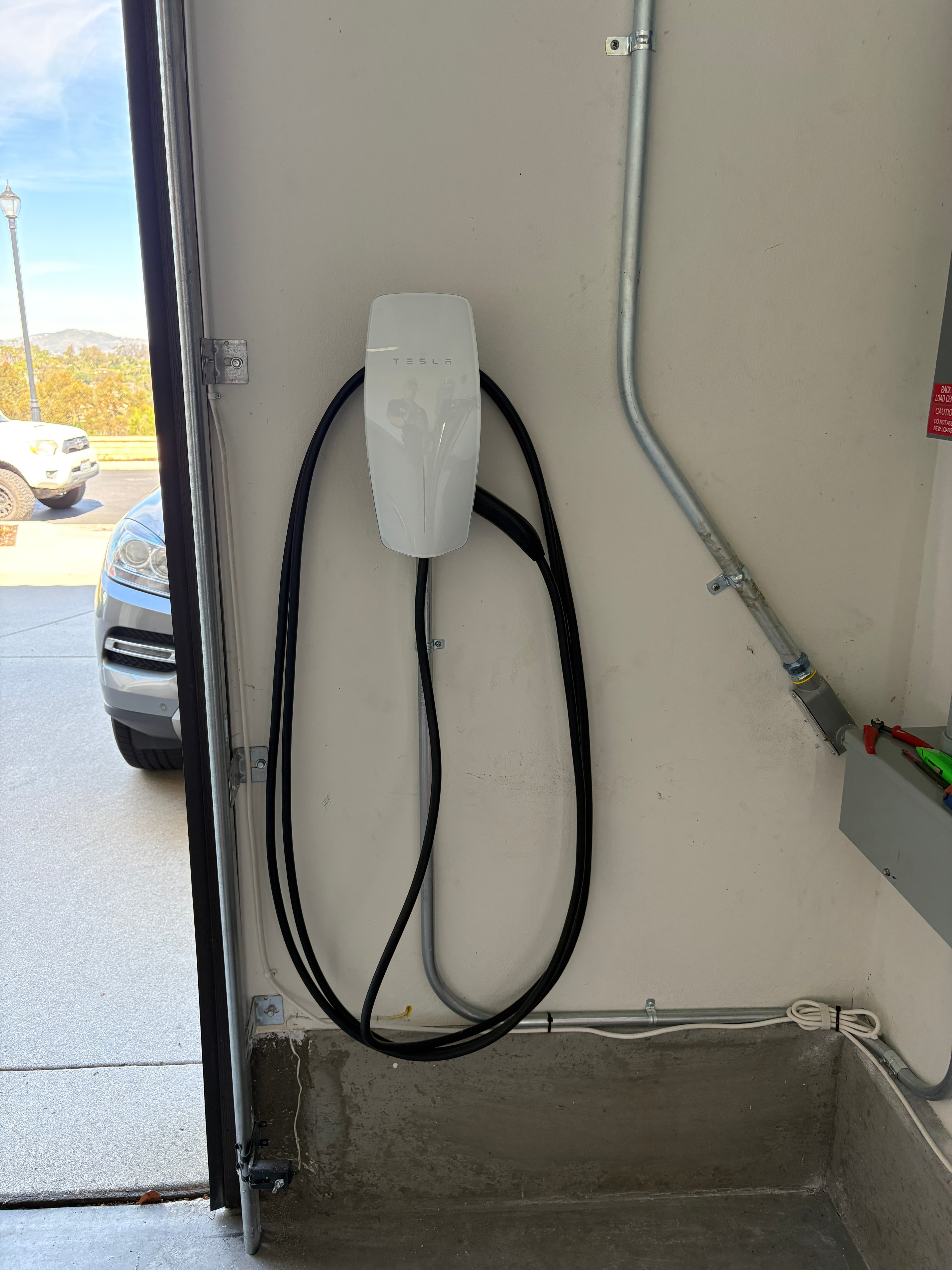 Tesla Wall Connector installed by RCH Renewables in North County San Diego garage