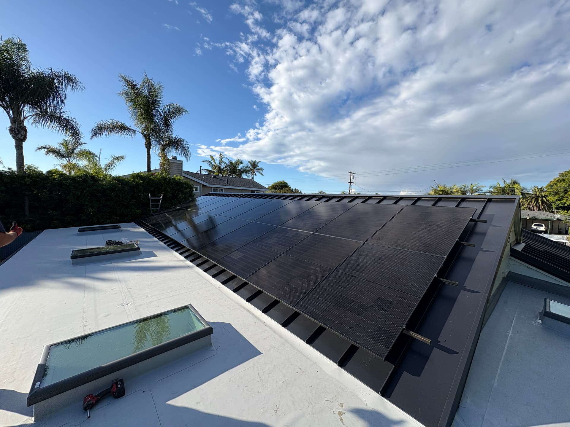 Completed residential solar install on a Carlsbad home, panels mounted on south-facing roof