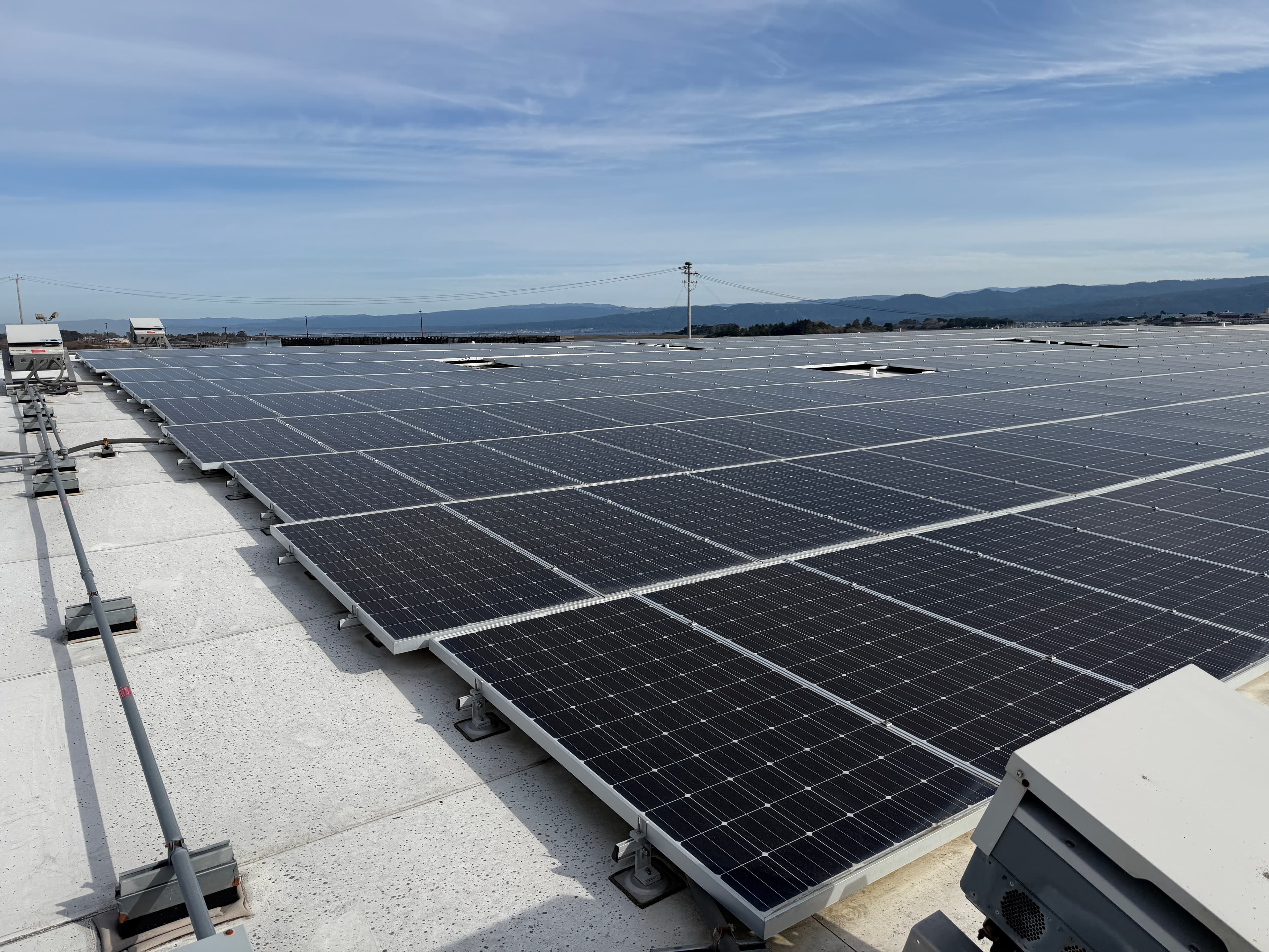 Overview of 717kW commercial rooftop solar array after wind storm