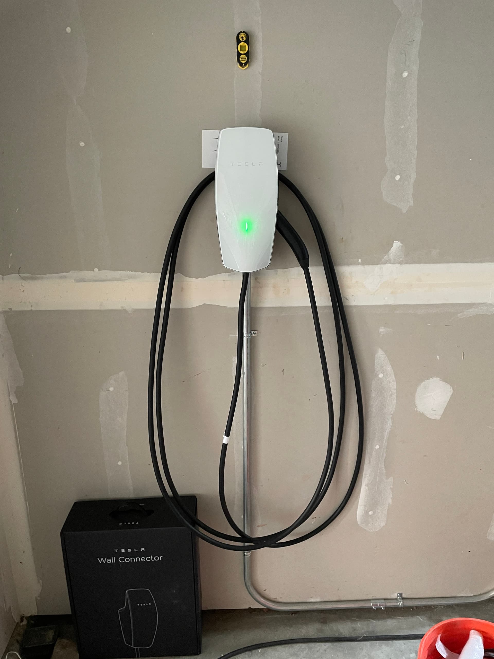 Ian Crilly commissioning a Tesla EV charger installation in North County San Diego